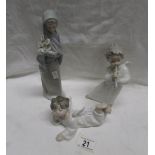 2 LLadro angels and a Lladro lady carrying lilies.