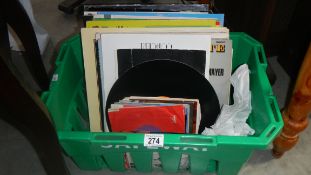 A box of assorted records.