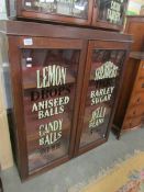 A 2 door cabinet with stencilled glass doors.