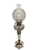 A silver plated oil lamp with glass font and acid etched glass shade. Base marked 'F.