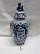 A blue and white ginger jar, nibbles to rim and chips to lid finial.