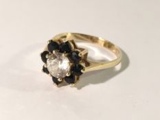 A 9ct gold cluster ring, size S.