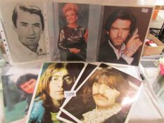 5 autographed photographs including Angela Lansbury, Pierce Brosnan, Tom Hanks, Gregory Peck,
