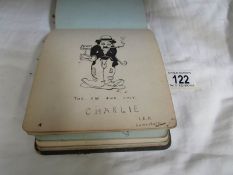 A circa 1917 -1920 autograph book with illustrations including Charlie Chaplin.