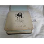 A circa 1917 -1920 autograph book with illustrations including Charlie Chaplin.