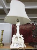 A ceramic table lamp with Griffin's on base and complete with shade.