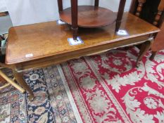 A walnut veneer coffee table.