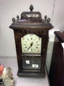 A tall mantel clock.