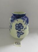 A Moorcroft style blue and white vase.