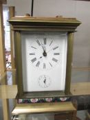 A brass and enamel repeater carriage clock. (repeater needs attention).