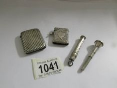 2 silver vesta cases, a silver cigar piercer and a silver pencil holder, all hall marked,