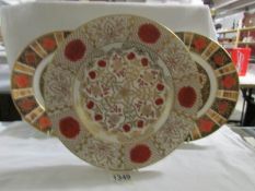 A pair of Imari pattern plates and an Abbeydale Imperial pattern plate,.