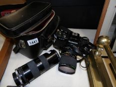 A Rolleiflex SL 35mm camera and 2 lenses (1:2.8-3.