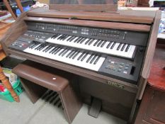 An organ and stool.