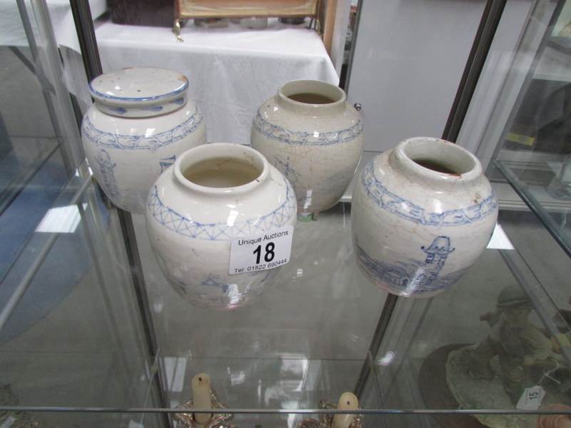 4 19th century blue and white oriental ginger jars, one with lid.