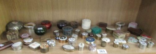 A mixed lot of trinket and pill boxes in enamel, wood, lacquer, bone etc.