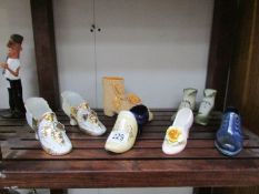 A quantity of ceramic shoes.