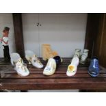 A quantity of ceramic shoes.