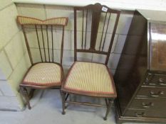 A inlaid chair and one other.