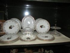 17 pieces of dinnerware and a Royal Albert cake stand.