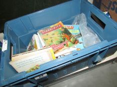 A quantity of tea card books, loose cards and picture story books.