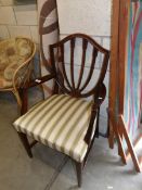 A mahogany shield back chair.