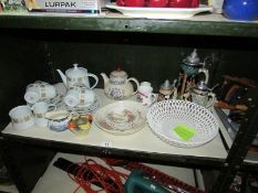 A shelf of assorted teaware, beer steins etc.