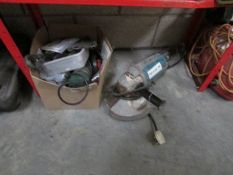 A large angle grinder and accessories.