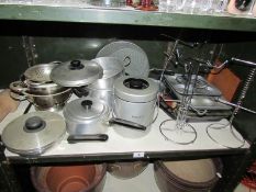 A shelf of kitchen ware.