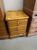 A pine 3 drawer bedside chest.