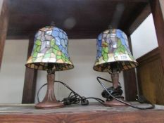 A pair of Tiffany style table lamps.