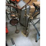 A brass companion set and a smokers stand.