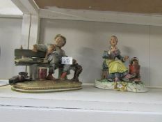 2 Capo di Monte style figures being an old man and a woman by stove.
