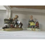 2 Capo di Monte style figures being an old man and a woman by stove.