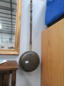 A copper warming pan,
