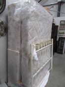 A double divan bed complete with mattress and headboard,