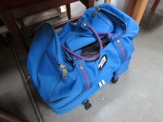 A Prohawk bowls bag with set of woods and clothing.