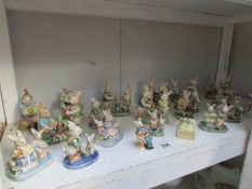 A shelf of rabbit and clown figures,.