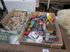 A box of play worn die cast including Corgi, Matchbox etc and a box of wooden building blocks.