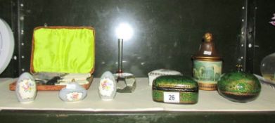 A shelf of miscellaneous items including trinket boxes.