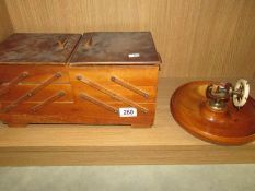 A metamorphic sewing box with contents a/f and a nut dish with nut cracker.