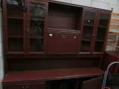 A mahogany effect wall unit.