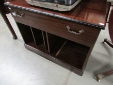 A mahogany effect television stand.