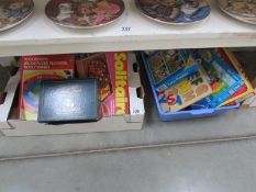 2 boxes of children's toys and games.