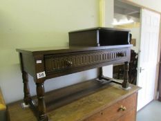 An oak telephone table.