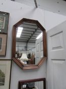 An octagonal framed mirror.