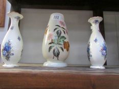 A pair of Royal Albert vases and an opaque glass vase with painted floral decoration.