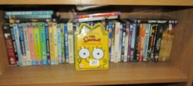 A shelf of assorted DVD's.