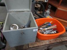 A small wooden box of tools and another box of tools,.