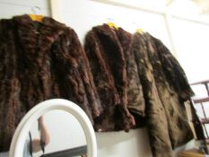 A fur coat and 2 fur jackets,